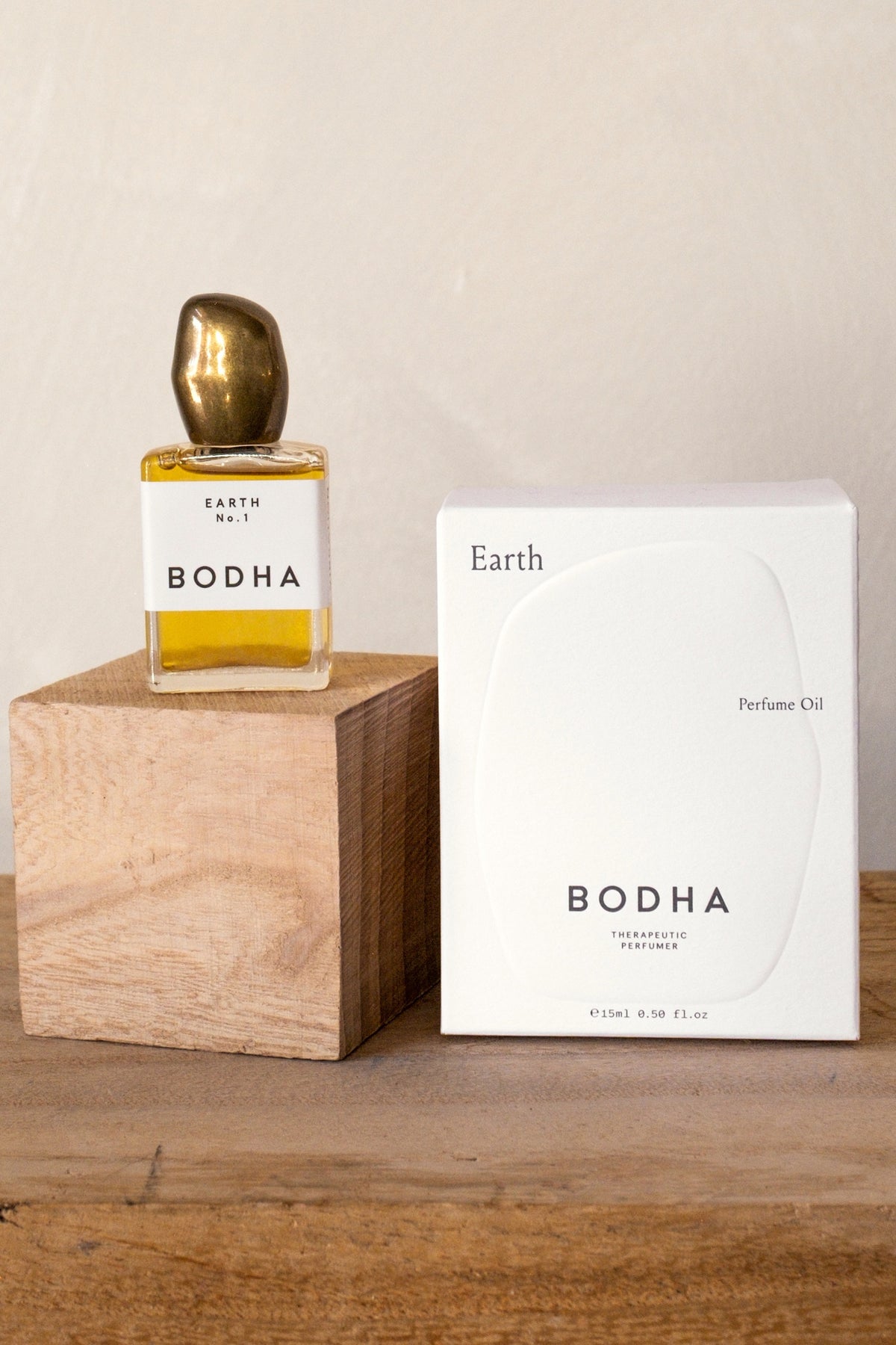 Bodha Earth perfume oil with box on a wood block
