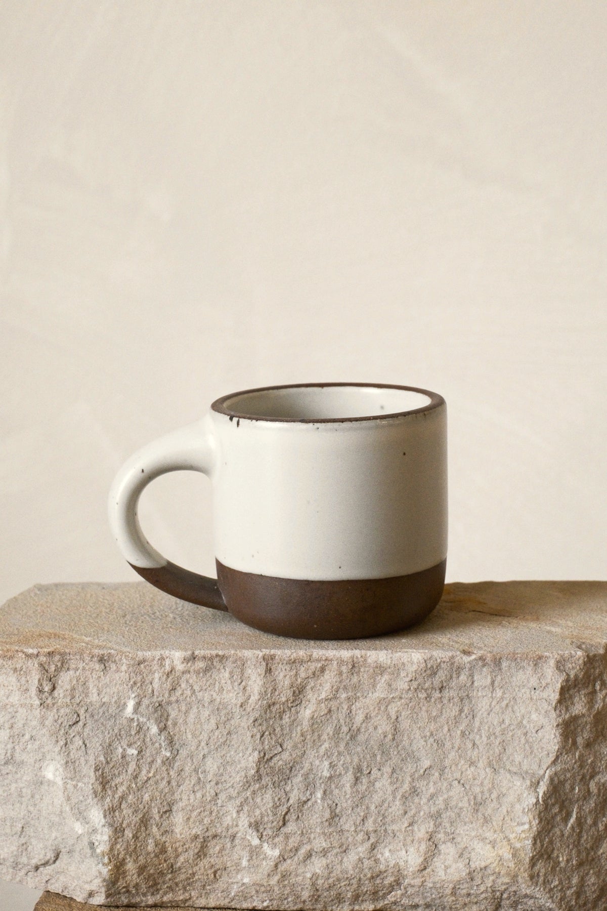 East Fork Small Mug in Panna Cotta on stone