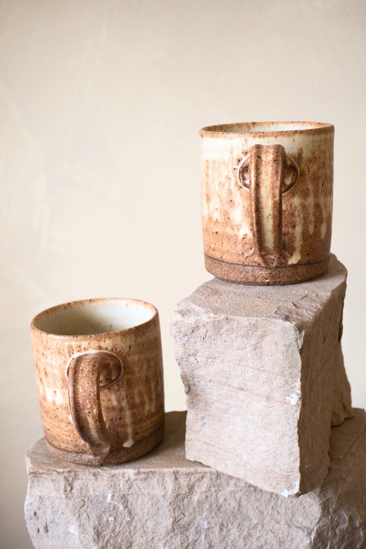 Liam Grinton cream mugs showing handles