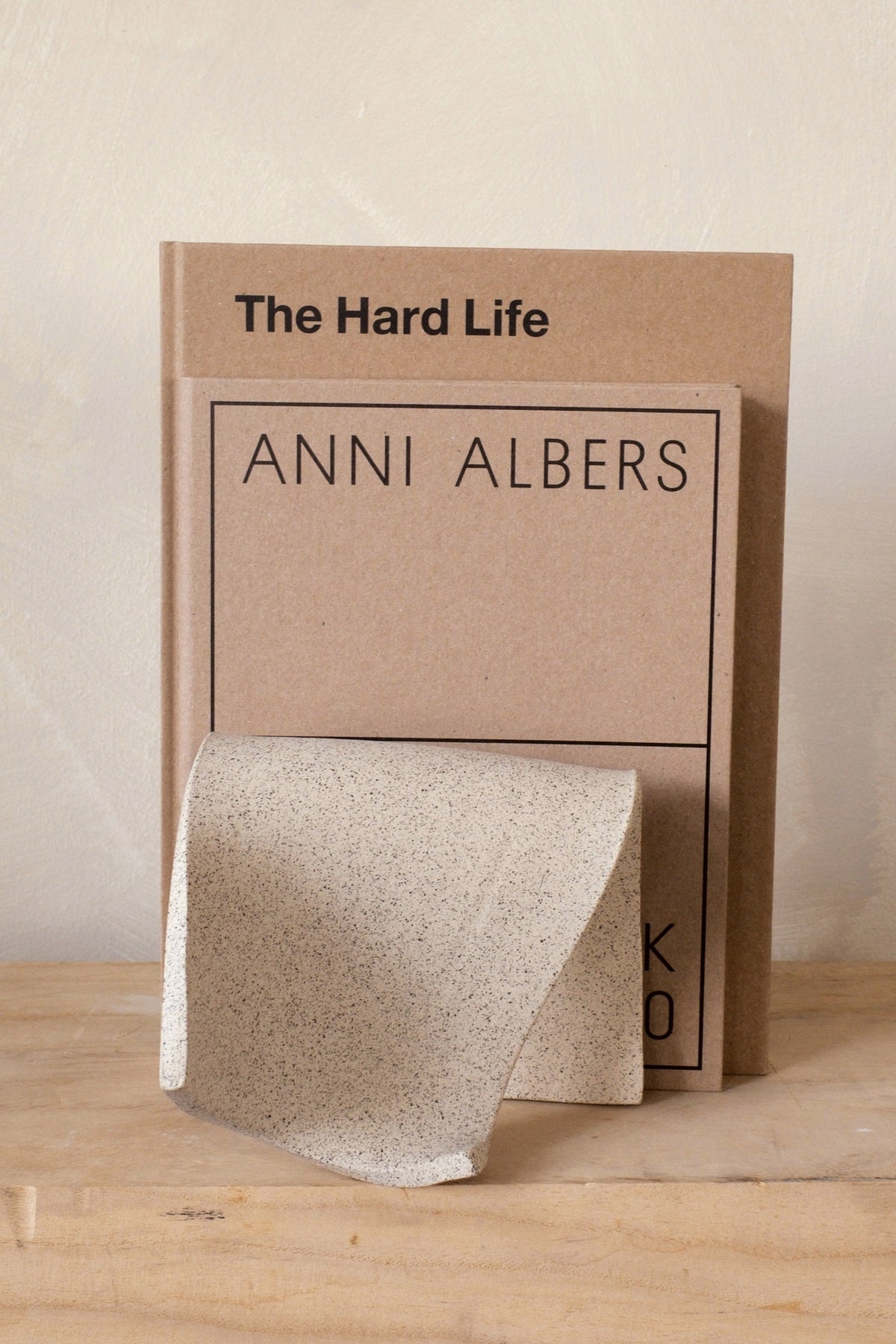 Sin Ceramics Serra bookend in sand with books